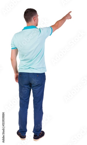 Back view of pointing young men in shirt and jeans.