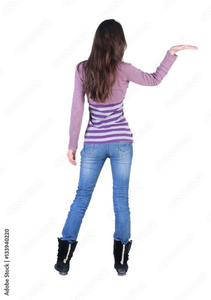 Beautiful young woman looking at wall. Beautiful young woman looking at wall.
