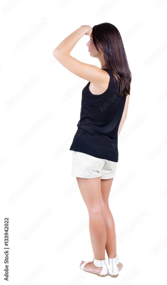 back view of standing young beautiful brunette woman. back view of standing young beautiful brunette woman.