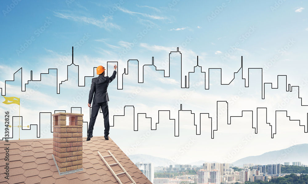 Man architect draw silhouette of modern city on blue sky. Mixed Man architect draw silhouette of modern city on blue sky. Mixed