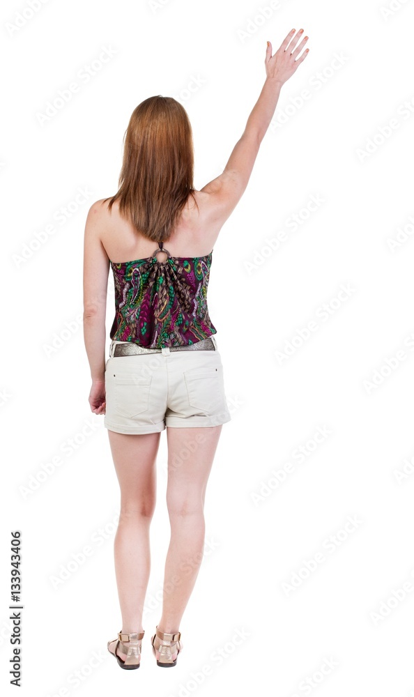 Back view of beautiful woman welcomes. Back view of beautiful woman welcomes.
