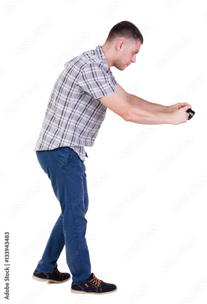 Back view of man photographing. tourist with camera. Back view of man photographing. tourist with camera.