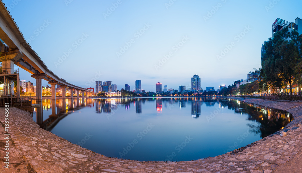 Panorama view of Hanoi cityscape by twilight period. Hoang Cau lake