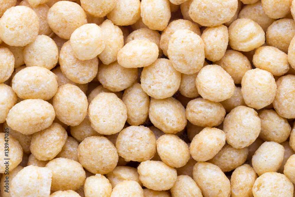 Corn flakes rings on the background. Corn flakes rings on the background.