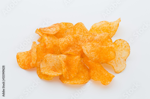 Cuadro en lienzo Crisps with paprica on a white background.