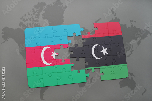 puzzle with the national flag of azerbaijan and libya on a world map