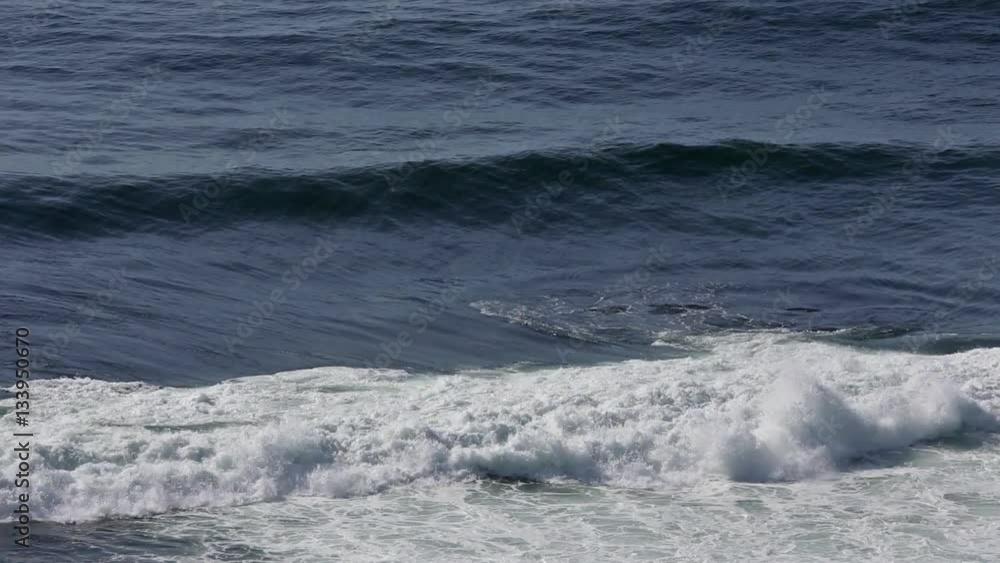 Ocean surf waves with foam and splashes. Top view. There is surf noise.
Ocean surf waves with foam and splashes. Top view. There is surf noise.