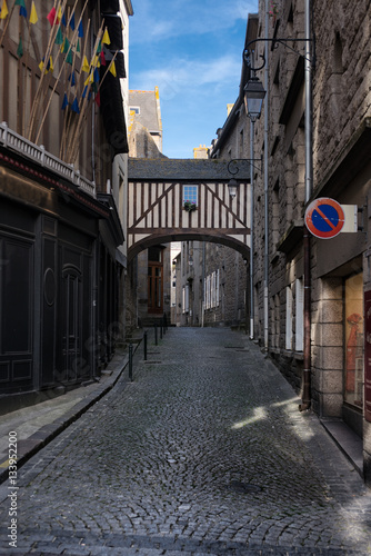 Wooden balcony connecting two houses in old city part of Saint-Malo, France