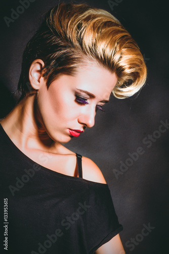 Wallpaper Mural Close-up of a girl with a short haircut. Dark background Torontodigital.ca