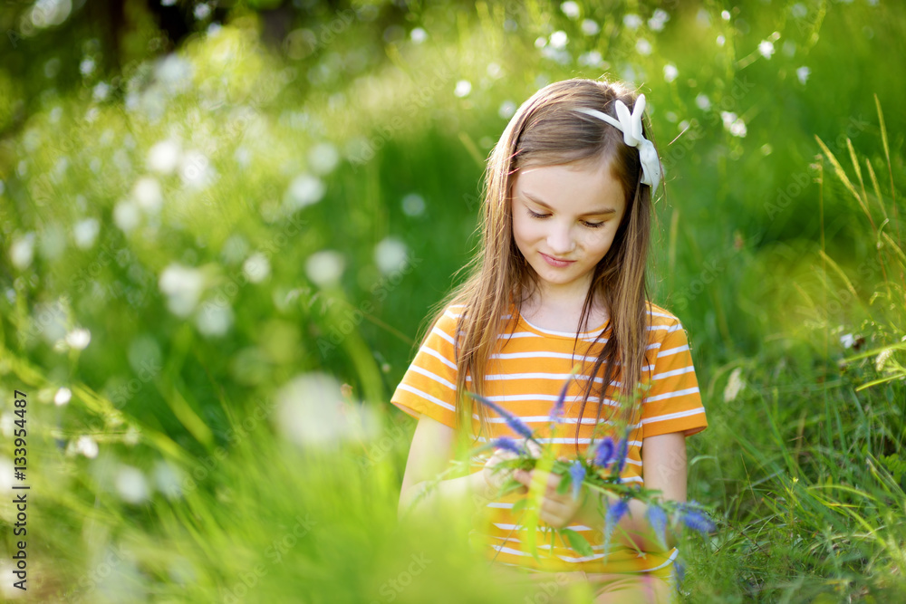 Portrait of cute little cheerful girl outdoors on summer day Portrait of cute little cheerful girl outdoors on summer day