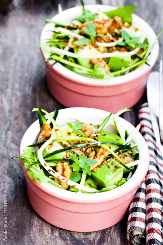 Healthy  green vegetarian salad with zucchini spaghetti and avoc photo