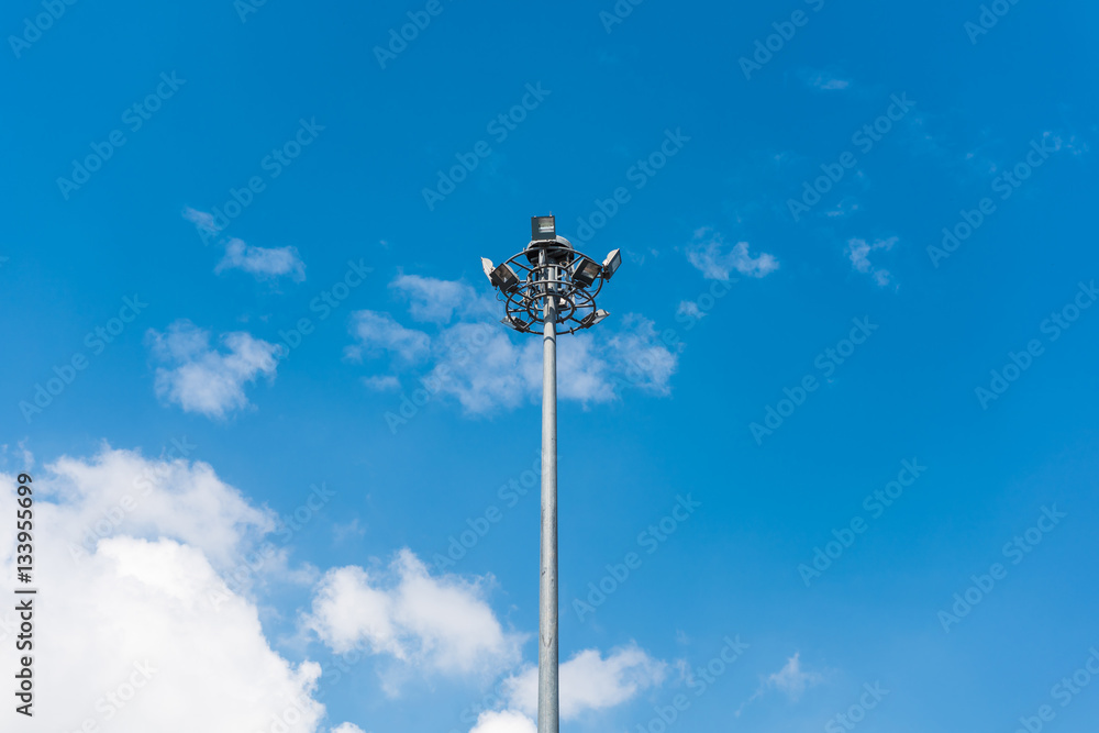 Spot light pole with blue sky