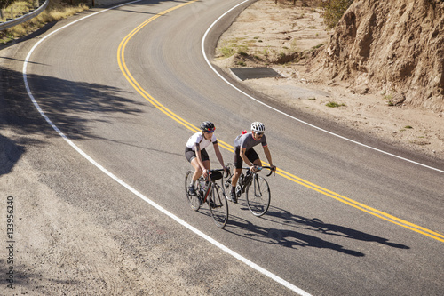 High angle view of friends biking on mountain road