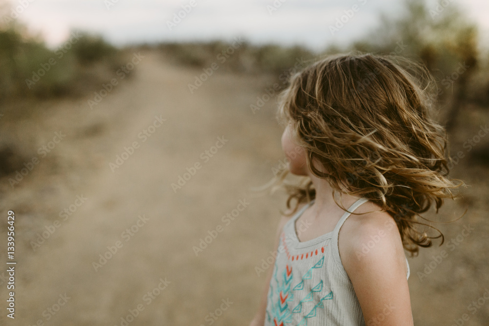 Girl shaking head while standing on field Girl shaking head while standing on field