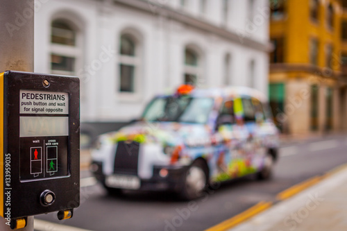 Colorful taxi at a pedestrian crossing