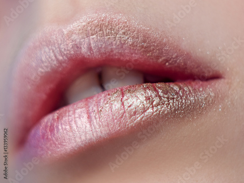 Lips, art make-up with shadows and Shine. Close-up, small depth of field