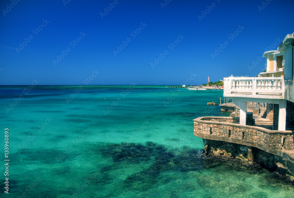 Clear blue waters of the Caribbean with stone dock