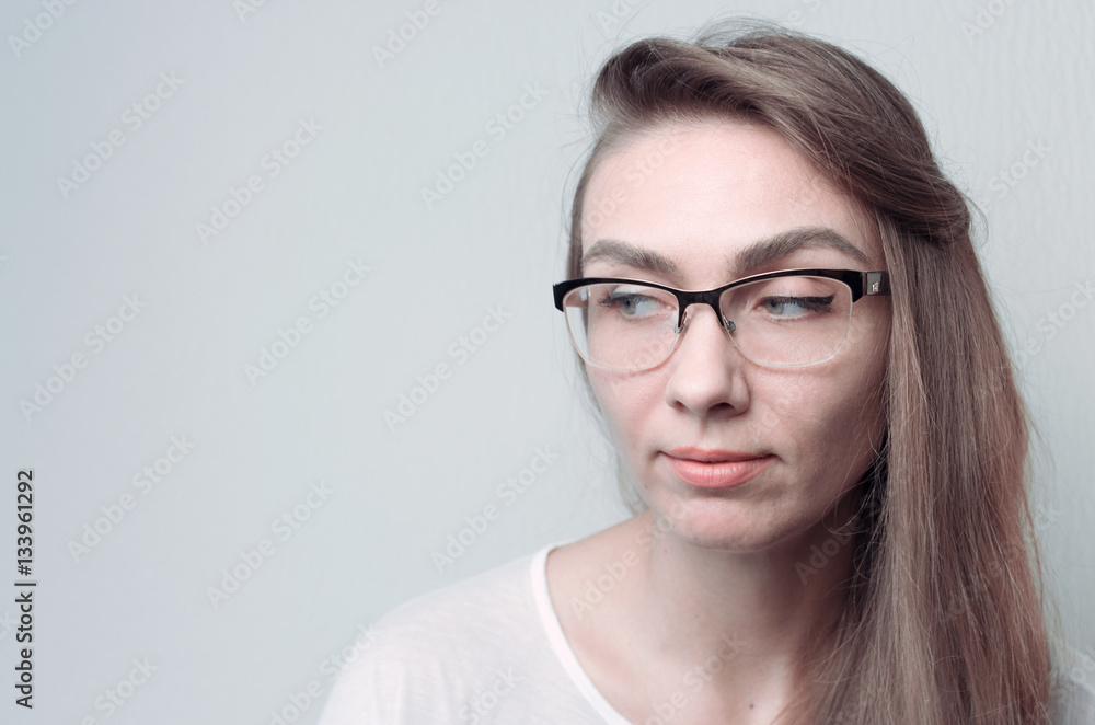 Fototapeta premium Young woman in glasses. Portrait