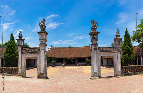 Front exterior view of Mong Phu communal house, a national relic in Duong Lam ancient village, Son Tay district, Hanoi, Vietnam. photo