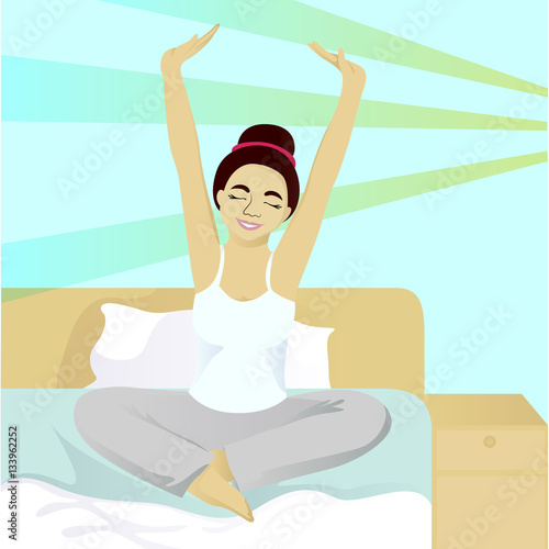 Girl stretches in bed in morning