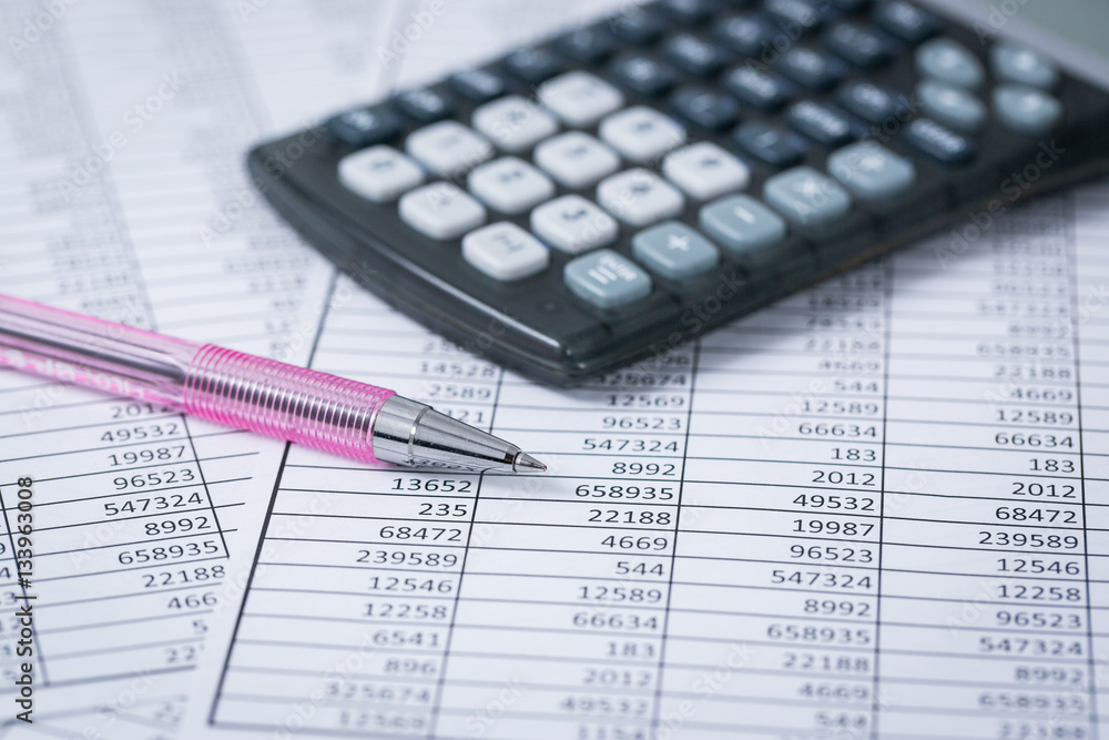 Calculator and statistics with a red pen Calculator and statistics with a red pen