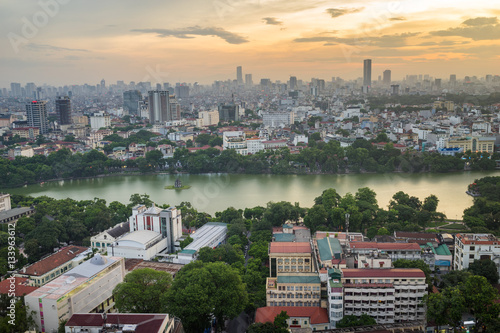 Aerial skyline view of Hoan Kiem lake (Ho Guom, Sword lake) area at twilight. Hoan Kiem is center of Hanoi city. Hanoi cityscape.