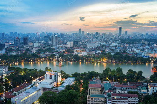 Aerial skyline view of Hoan Kiem lake (Ho Guom, Sword lake) area at twilight. Hoan Kiem is center of Hanoi city. Hanoi cityscape.