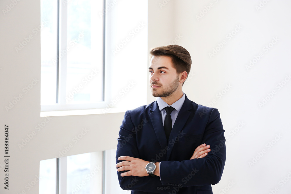 Young businessman in office building Young businessman in office building