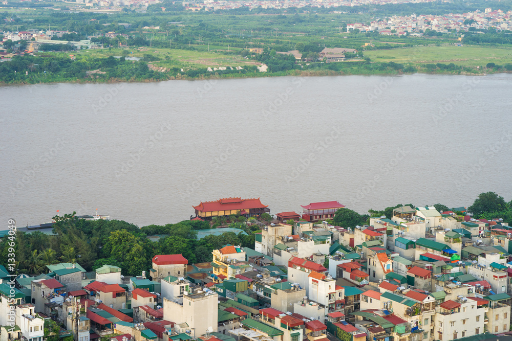 Aerial skyline view of resident houses staying by Red River in Hoan Kiem district, Hanoi, Vietnam