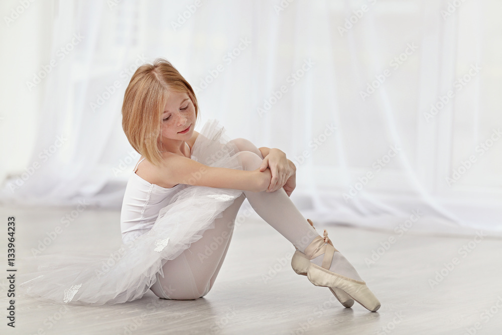 Fototapeta premium Small ballerina dancer at home