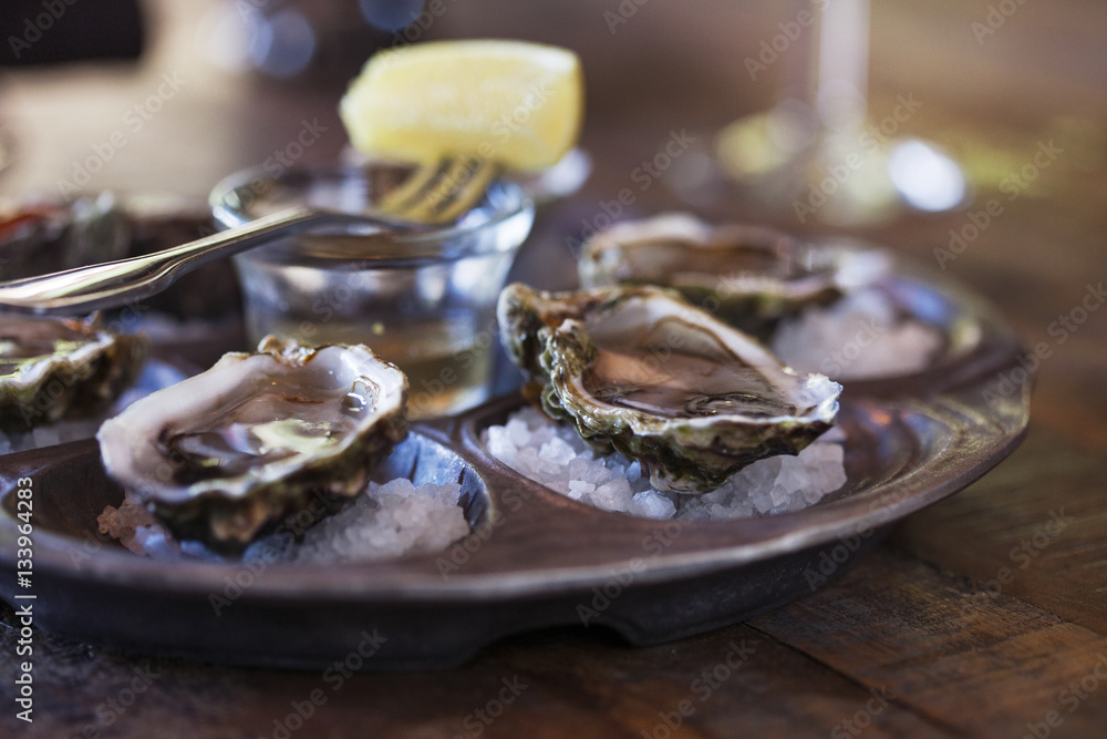 Oyster shells served on table Oyster shells served on table