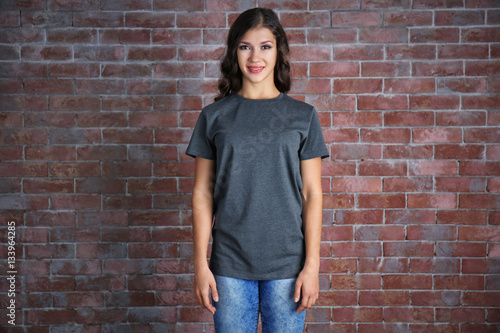 Young woman in blank grey t...