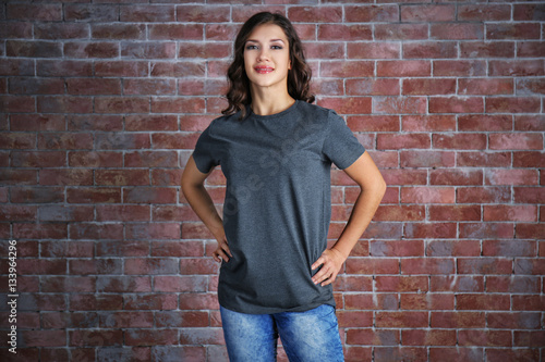 Young woman in blank grey t...