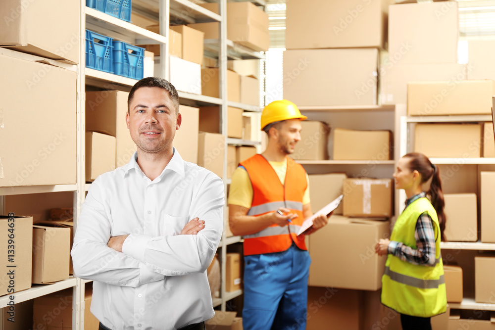 Young businessman at warehouse Young businessman at warehouse
