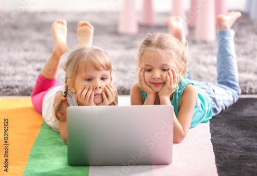Adorable little sisters wit...