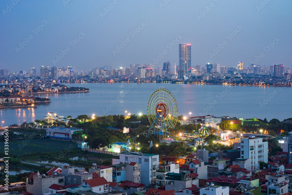 Aerial skyline view of north West Lake. Hanoi cityscape at twilight