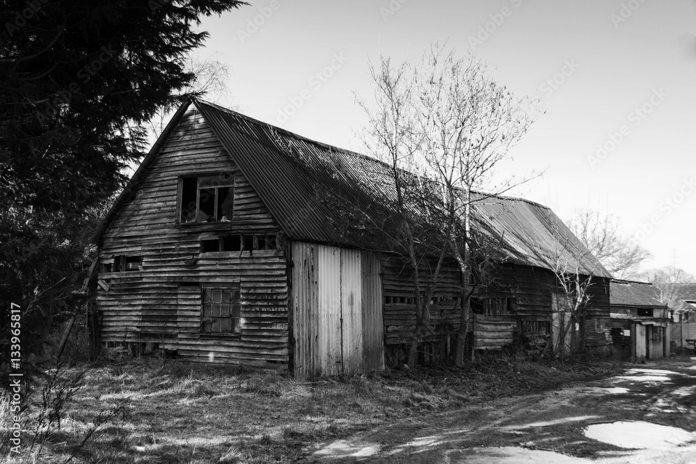 Old derelict empty wooden barn in country Old derelict empty wooden barn in country