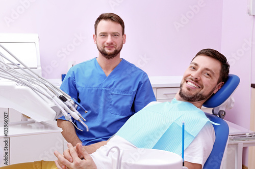Happy young man and male de...