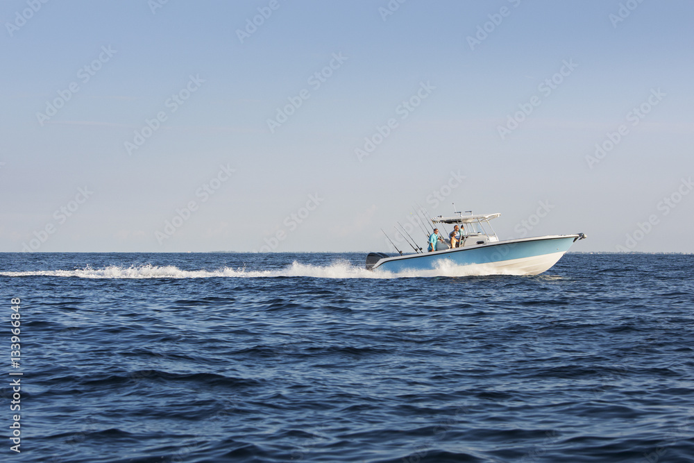 Friends travelling on boat at sea against clear sky Friends travelling on boat at sea against clear sky
