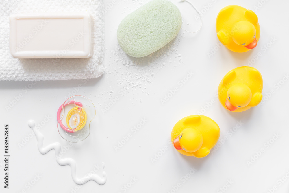 baby accessories for bath with duck on white background baby accessories for bath with duck on white background