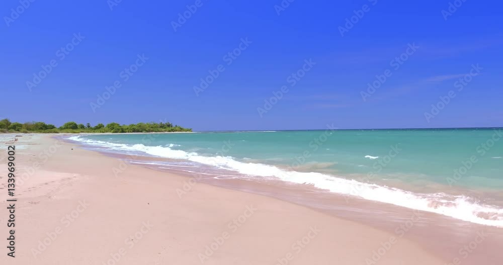 View of long and clean sandy beach on sea coast at sunny summer day with nobody View of long and clean sandy beach on sea coast at sunny summer day with nobody