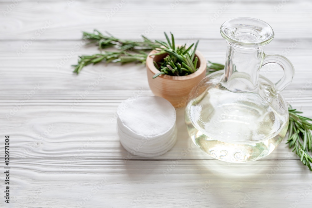 organic cosmetics with extracts of herbs rosemary on wooden background organic cosmetics with extracts of herbs rosemary on wooden background