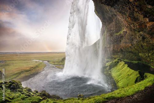 Seljalandsfoss  Iceland - Passage under the waterfall with rainb