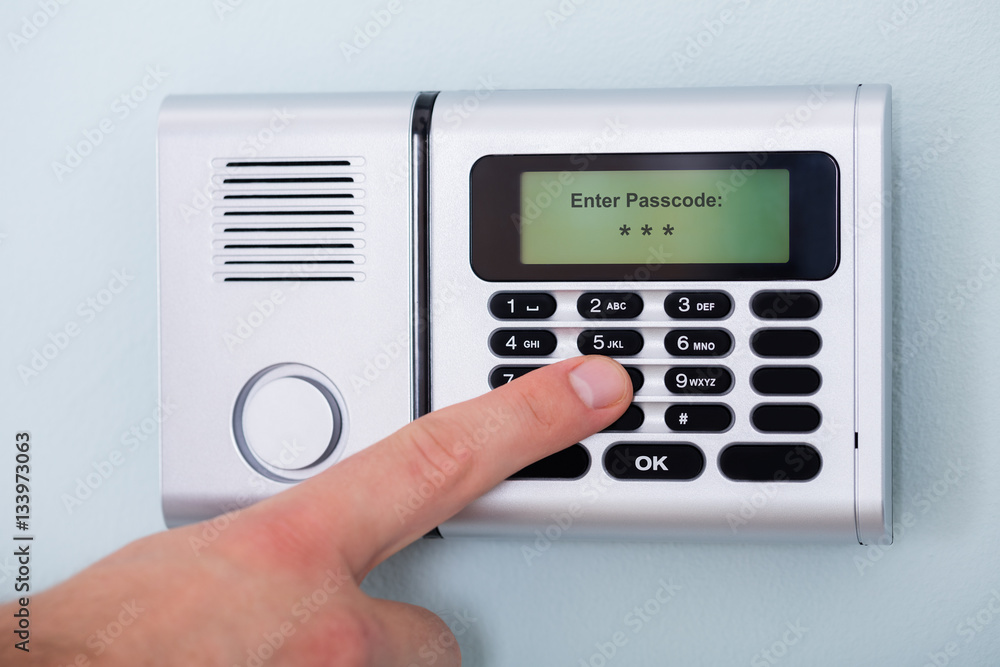 Person's Finger Entering Code In Security System Person's Finger Entering Code In Security System