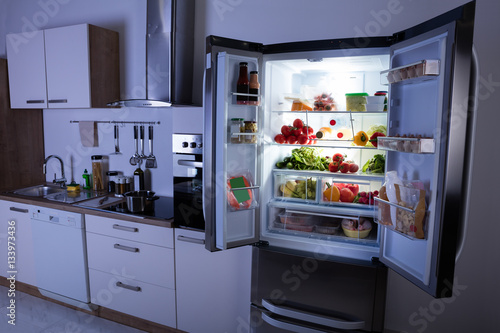 Open Refrigerator In Modern Kitchen