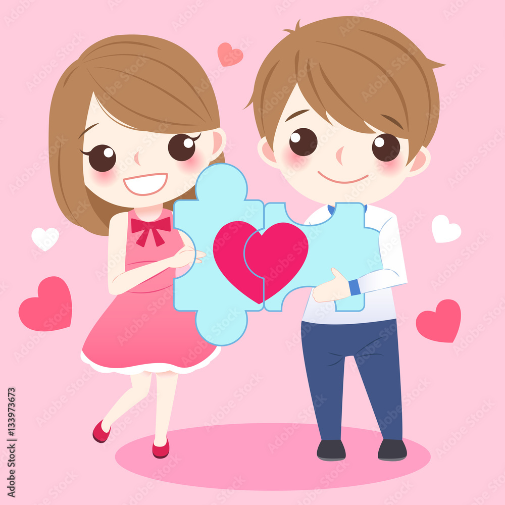 couple holding red love puzzle couple holding red love puzzle