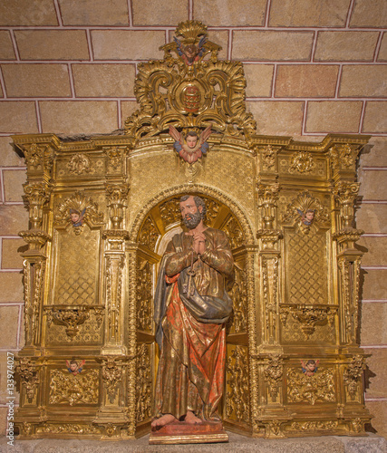 AVILA, SPAIN, APRIL - 19, 2016: The carved polychrome baroque altar of St. Peter in church Basilica de San Vicente.