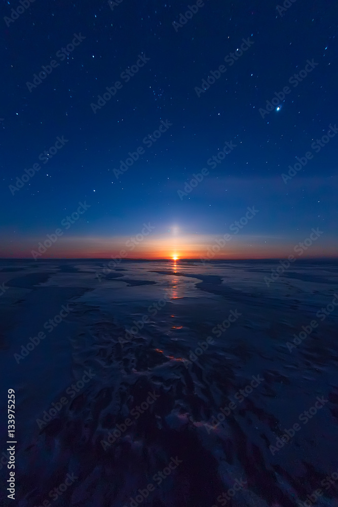 textured tile blue ice hummock of Lake Baikal at moon light. Olk