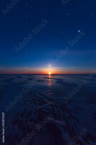 textured tile blue ice hummock of Lake Baikal at moon light. Olk