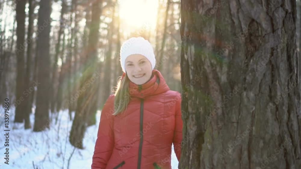 Beautiful young woman in winter park, smiling, and having fun. Slow motion video. Beautiful young woman in winter park, smiling, and having fun. Slow motion video.